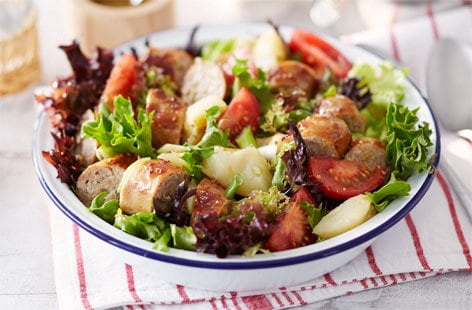 Image of "Sticky sausage and crushed new potato salad"