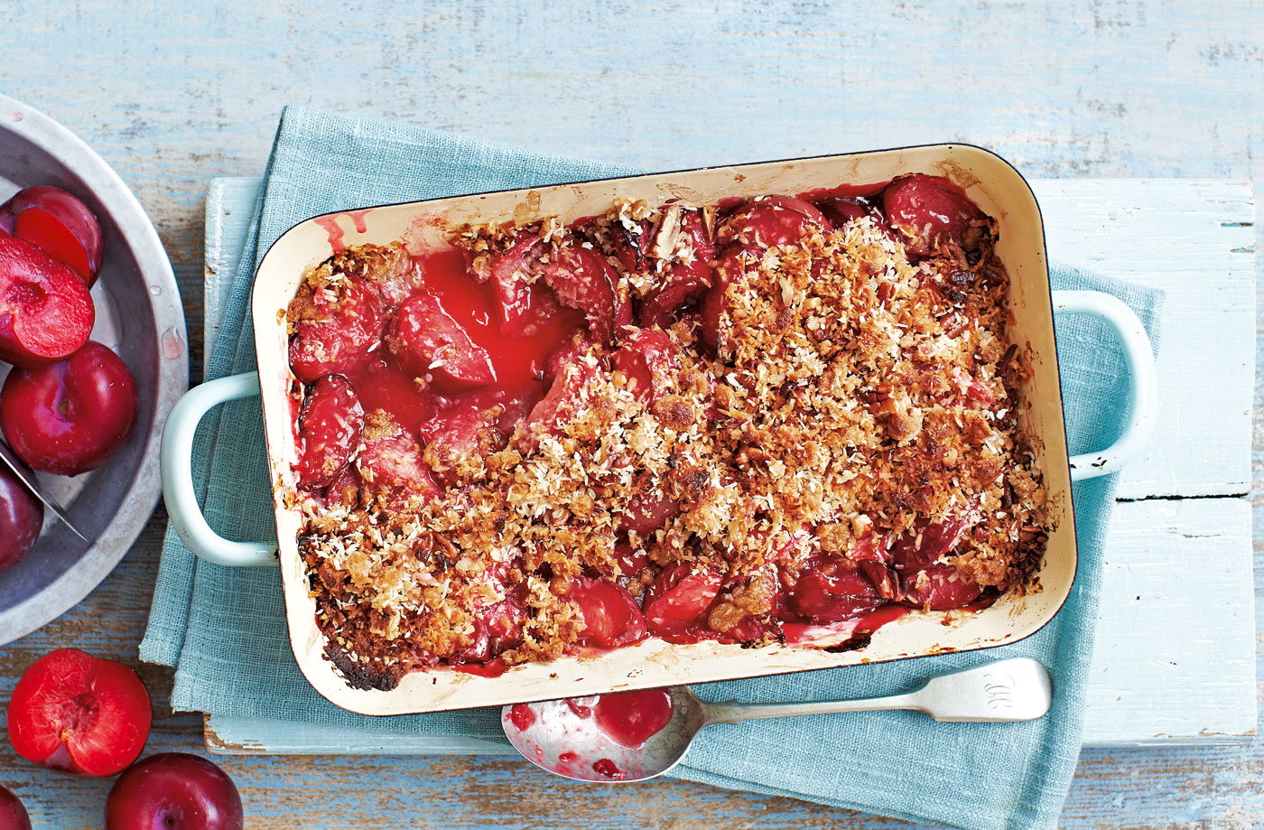 Baked plum and coconut crisp