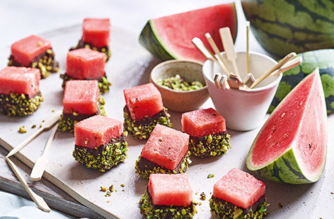 Image of "Chocolate-dipped watermelon with crushed pistachios"