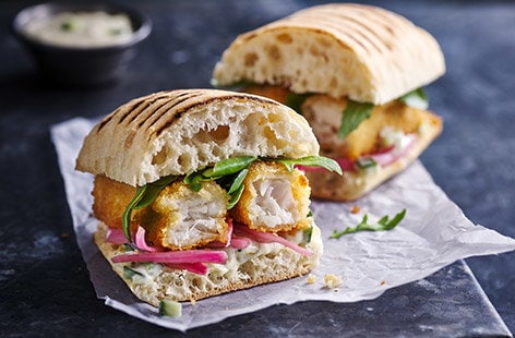Image of "Fish finger and pickled pink onion panini"