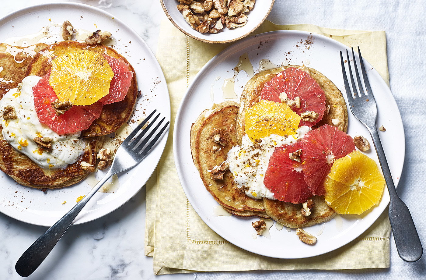 Yogurt and honey pancakes with citrus fruit