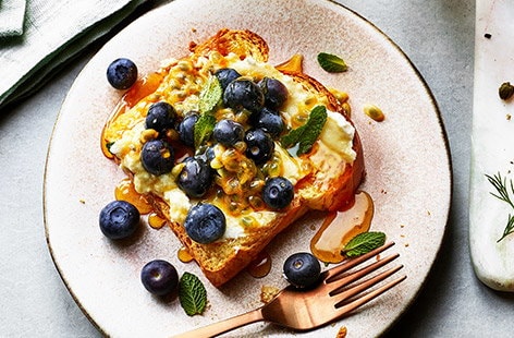 Image of "Ricotta and blueberry open sandwich"