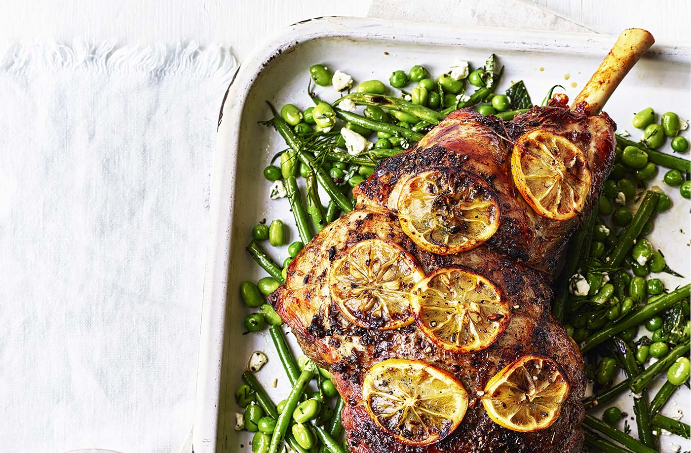 Roasted leg of lamb stuffed with feta, olives and pistachios