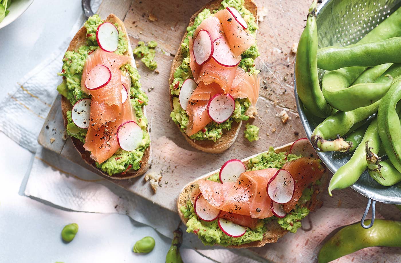Salmon, smashed avocado and broad bean bruschetta