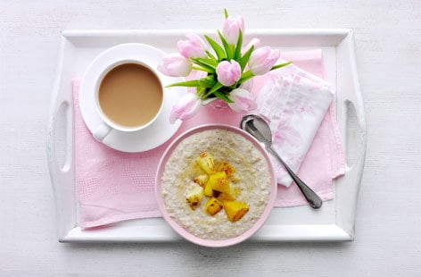 Image of "Slow-cooked coconut porridge with warm tropical fruit"