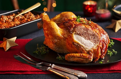 Image of "Brie and cranberry-stuffed chicken wrapped in bacon"