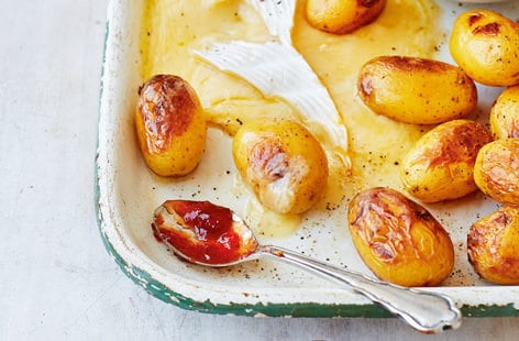 Image of "Baked Cornish potatoes and Brie with pickles"