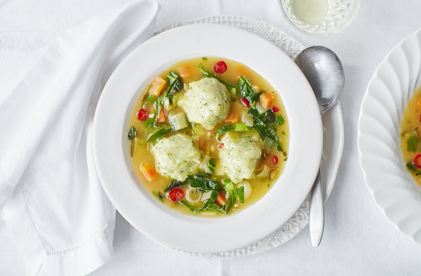 Spring vegetable broth with herby dumplings