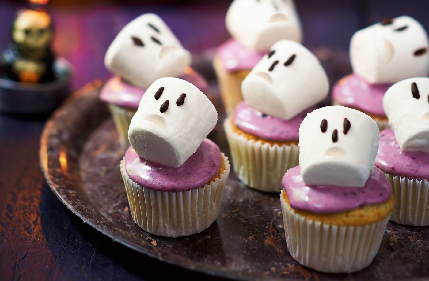 Spooky blackberry cupcakes with marshmallow skulls