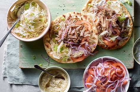 Image of "Pulled pork souvlaki flatbreads with slaw"