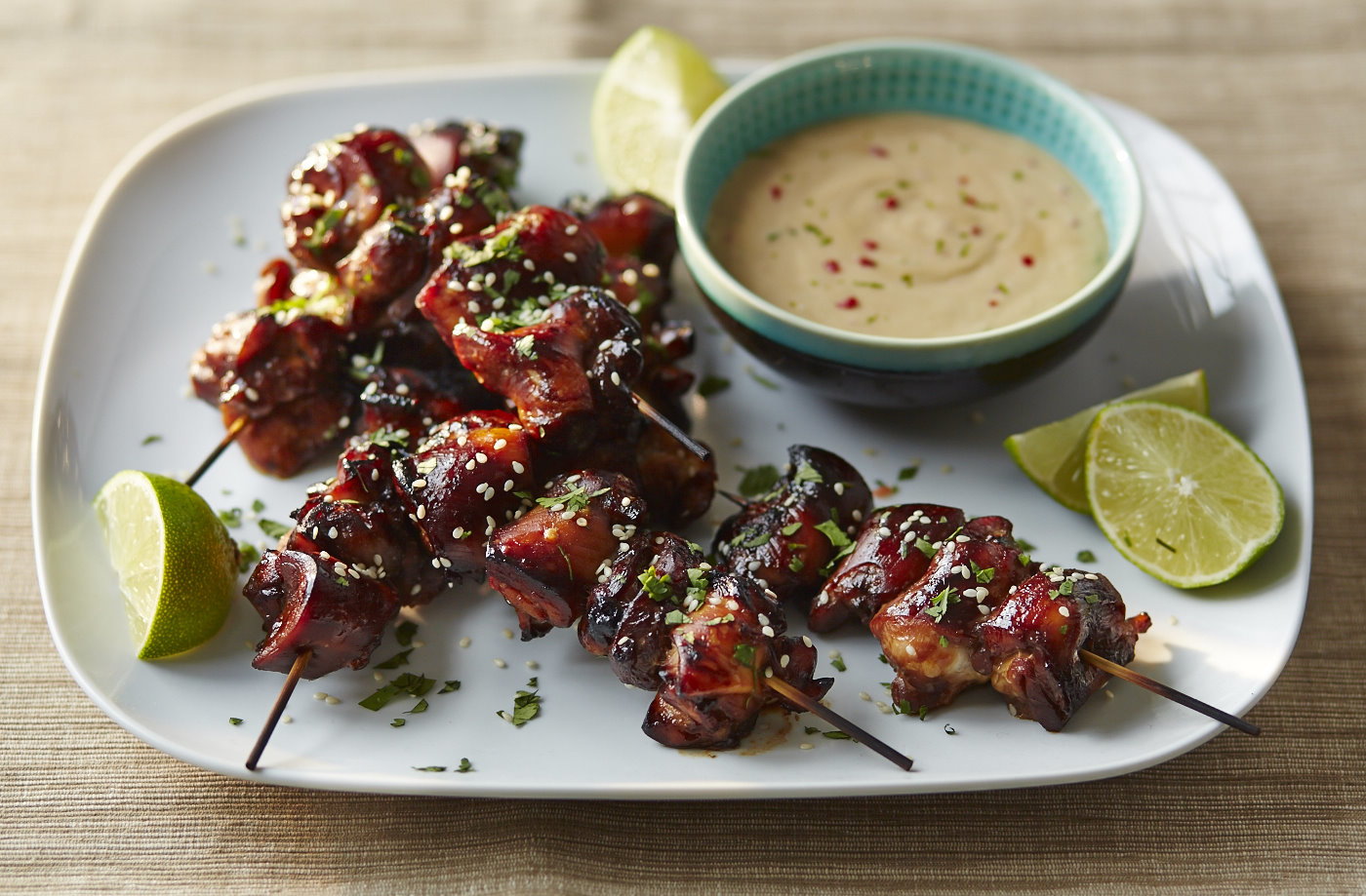Sticky teriyaki chicken bites with peanut dip