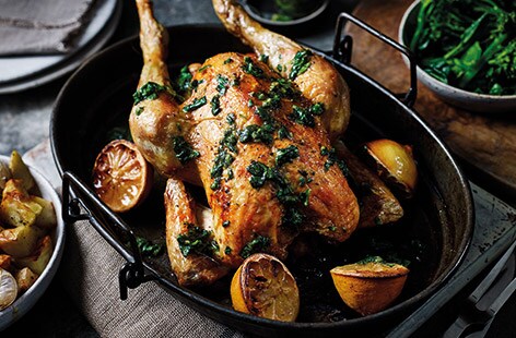 Image of "Roast chicken with basil and lemon salsa and garlic potatoes"