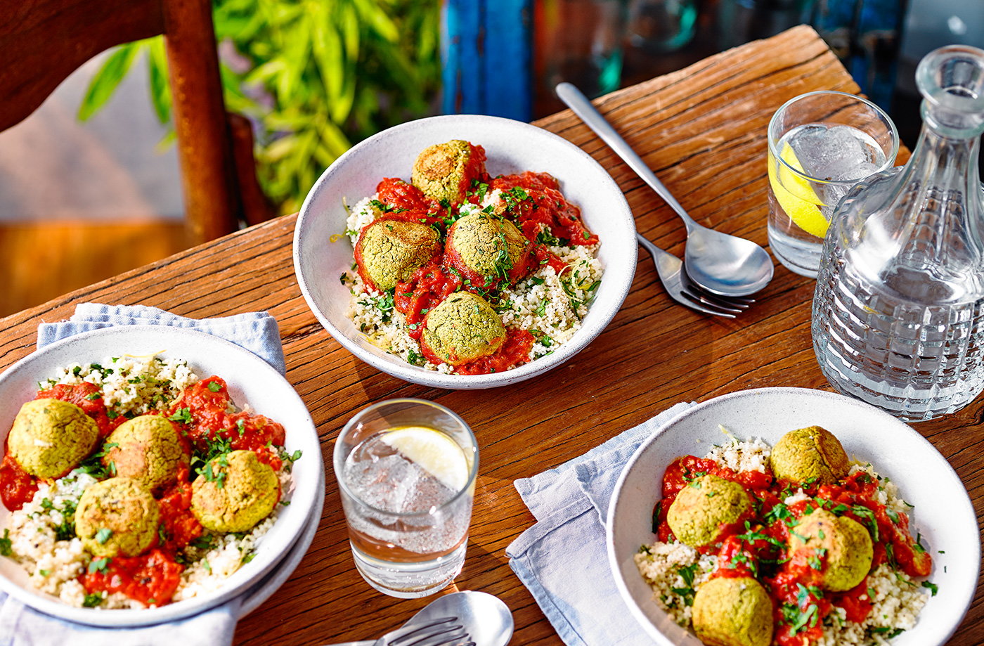 Tomato falafel traybake with lemony couscous