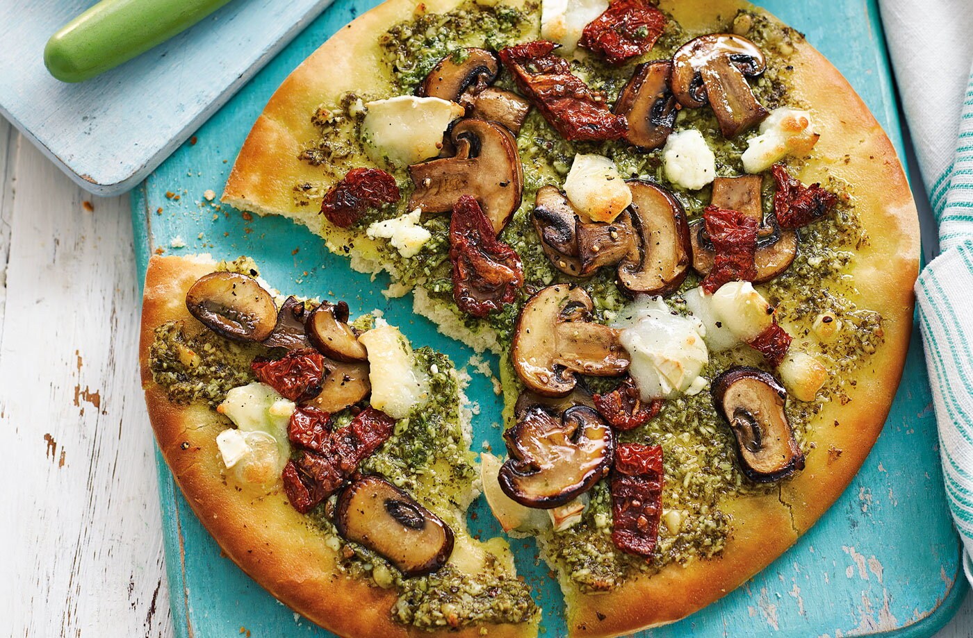 Pizza Bianca with garlic mushrooms, pesto and goat's cheese