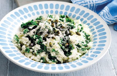 Image of "Baked kale risotto with pumpkin seeds"
