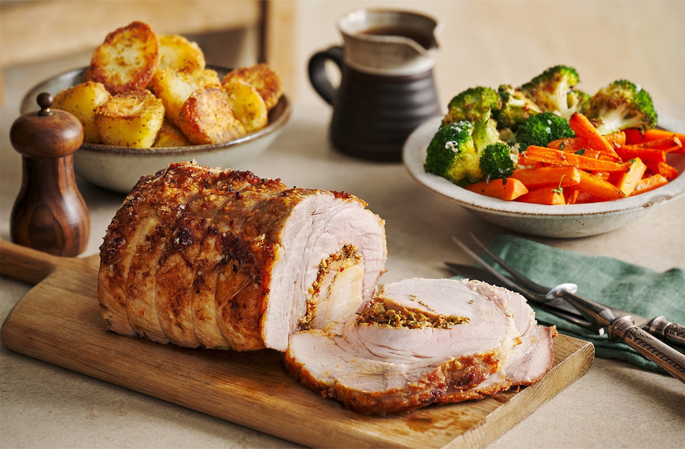 Porchetta-style roast pork with herb-roasted vegetables