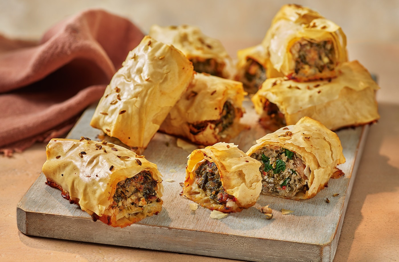 Spanakopita sausage rolls