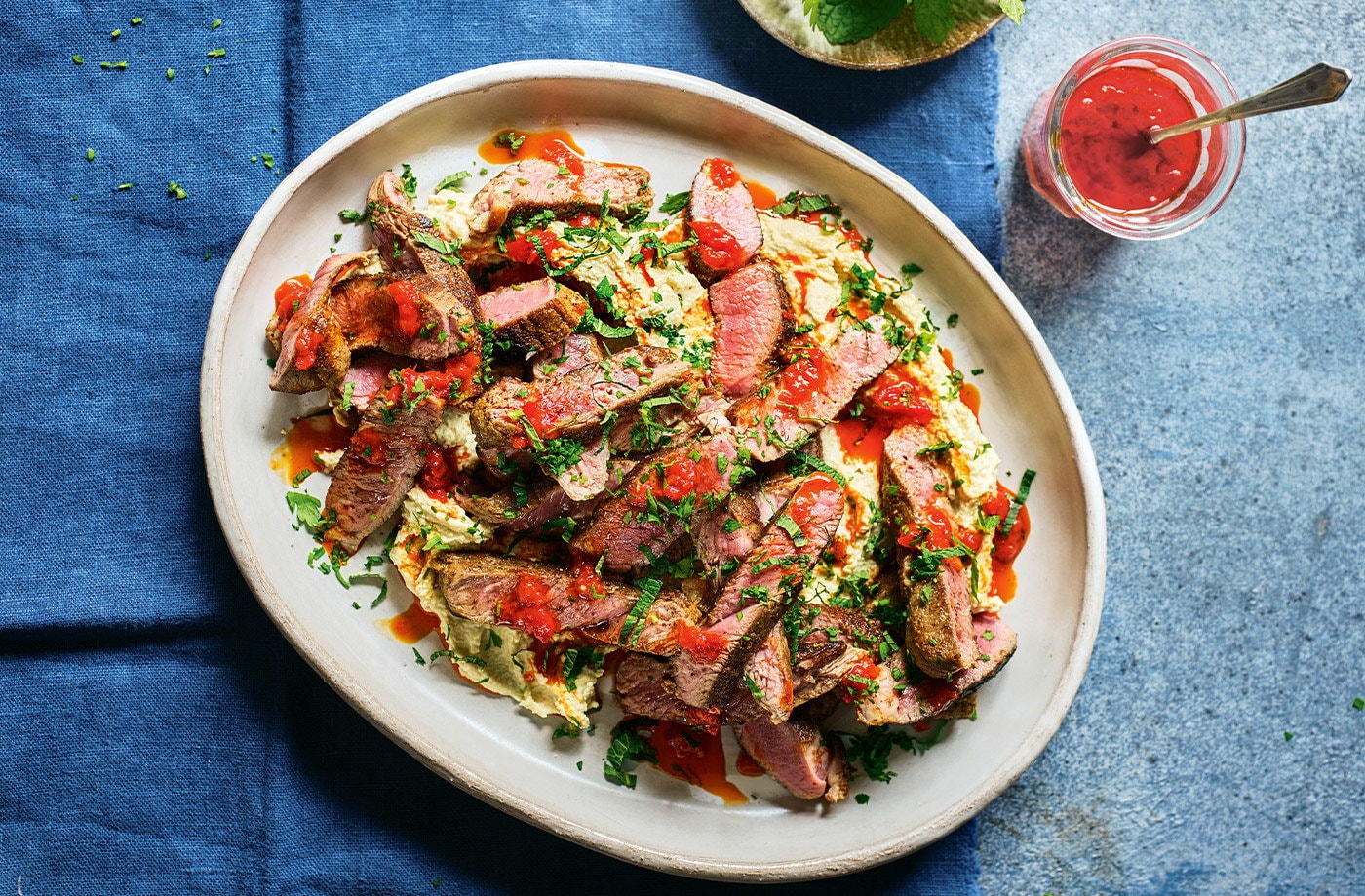 Grilled lamb with houmous and harissa