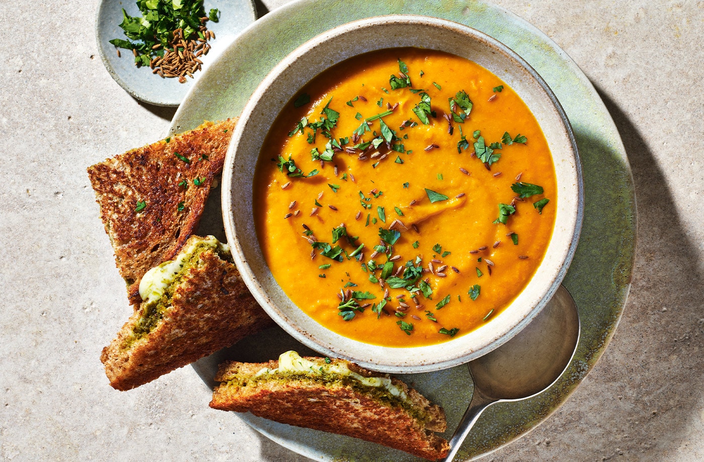 Spiced carrot and lentil soup with cheesy pesto toasties
