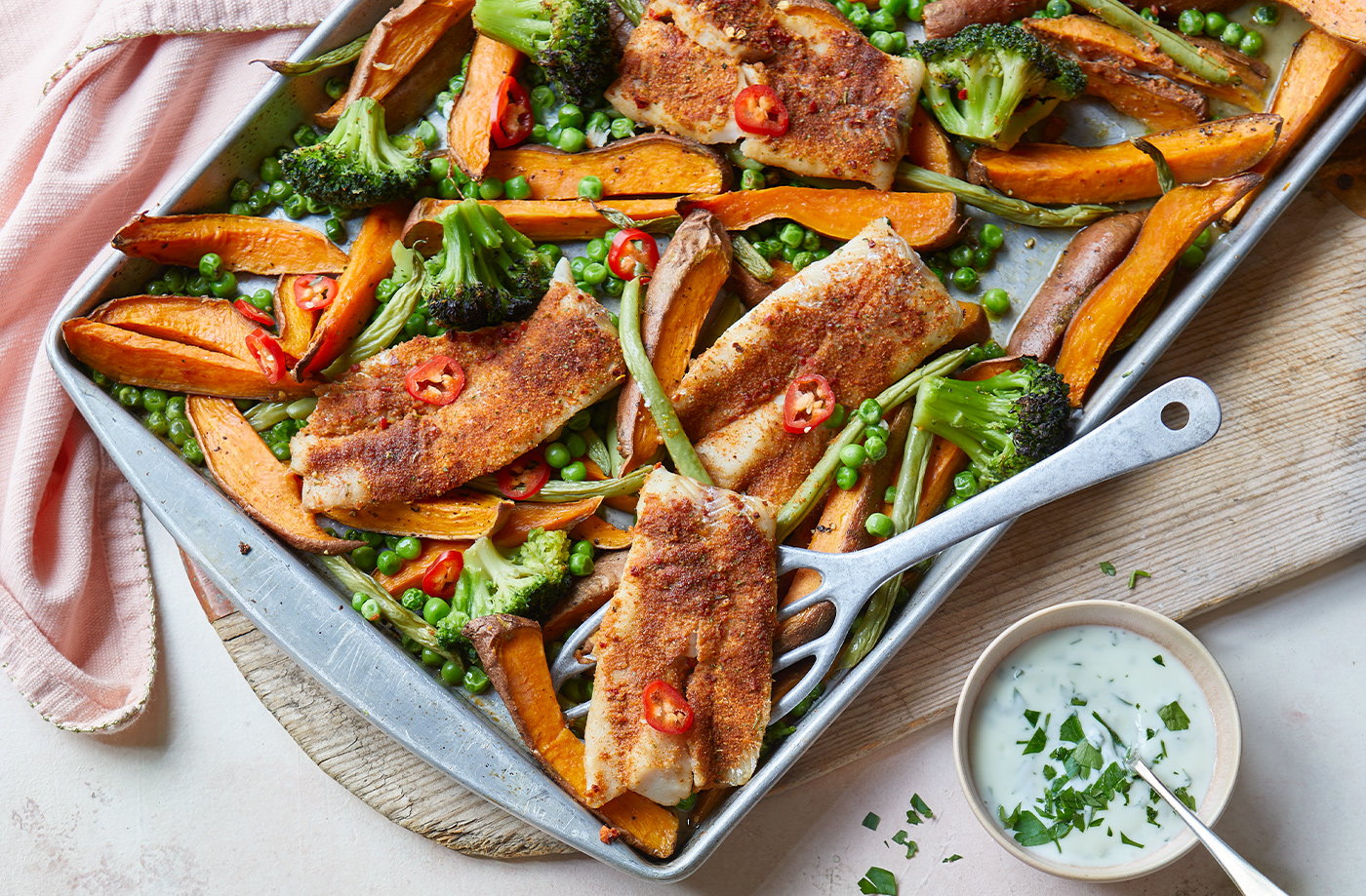 Piri-piri fish, sweet potato and broccoli traybake