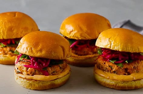 Image of "Spicy salmon burgers with slaw"