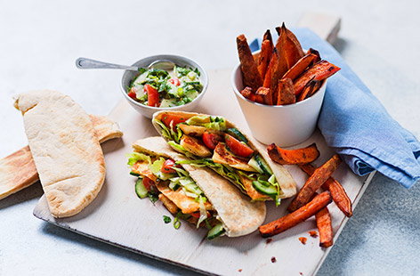 Image of "Halloumi pittas with sweet potato wedges"