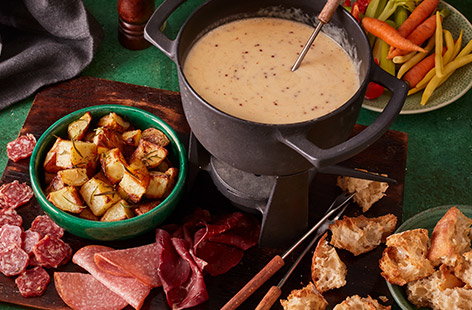 Image of "Cheese and beer fondue with dipping platter"