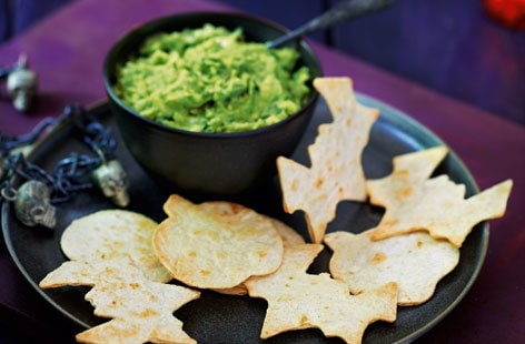 Image of "Slime dip with spooky tortilla shapes"
