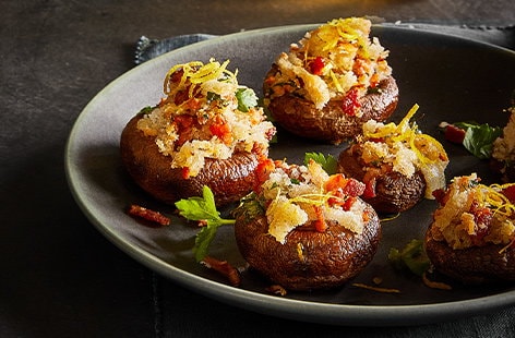 Image of "Smoked bacon and Manchego stuffed mushrooms"