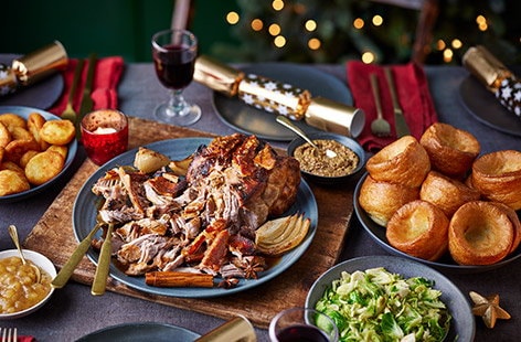 Image of "Spiced mulled pulled pork with Yorkshire puddings and shredded sprouts "