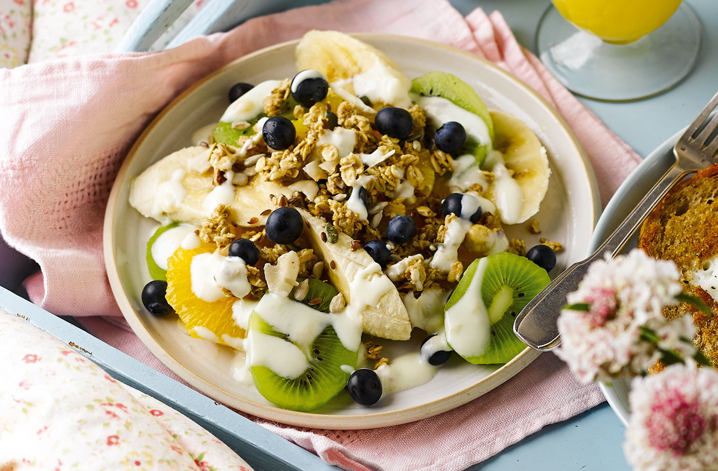 Fruit salad plate with yogurt and granola
