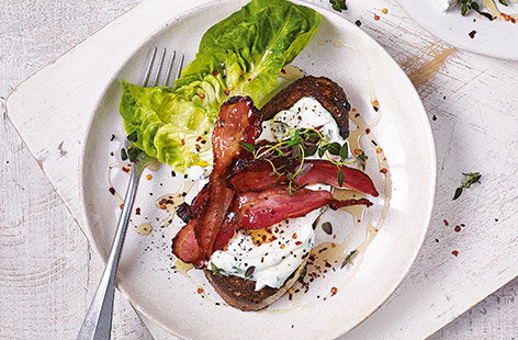 Image of "Soft cheese and bacon on toast"