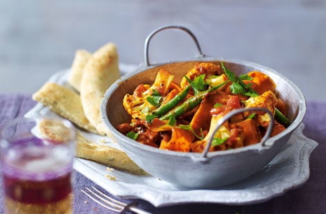 Image of "Spiced vegetable balti with garlic naan"