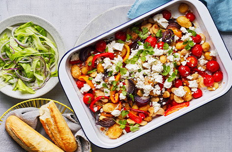 Image of "Crispy new potato, pepper and feta traybake"