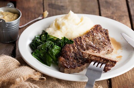 Steak with mash and wilted spinach