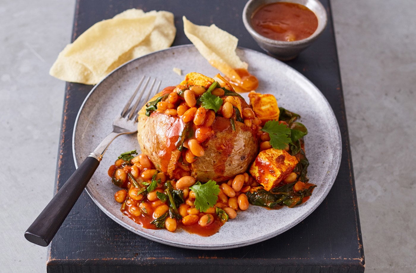 Jacket potatoes with curried beans and paneer