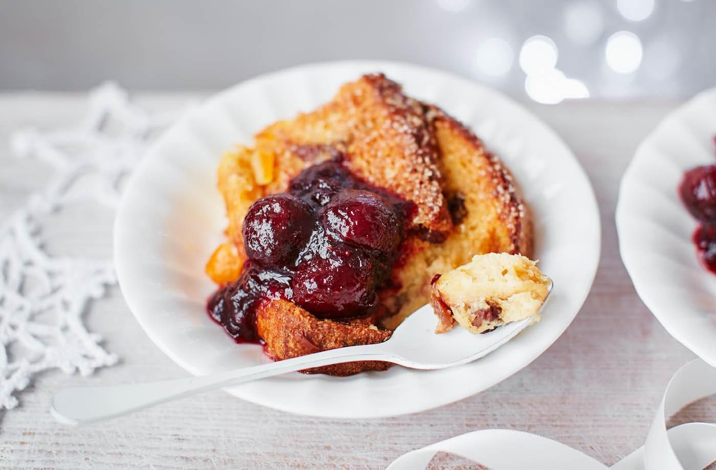 Baked panettone French toast with clementine, black cherry and cranberry sauce