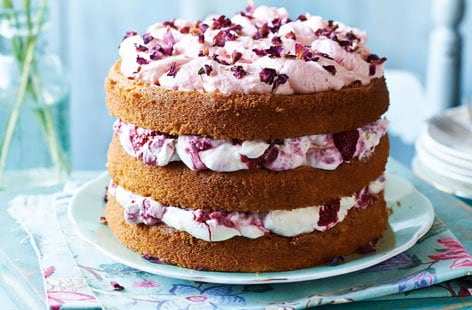 Image of "Raspberries and cream cake with rose petals"