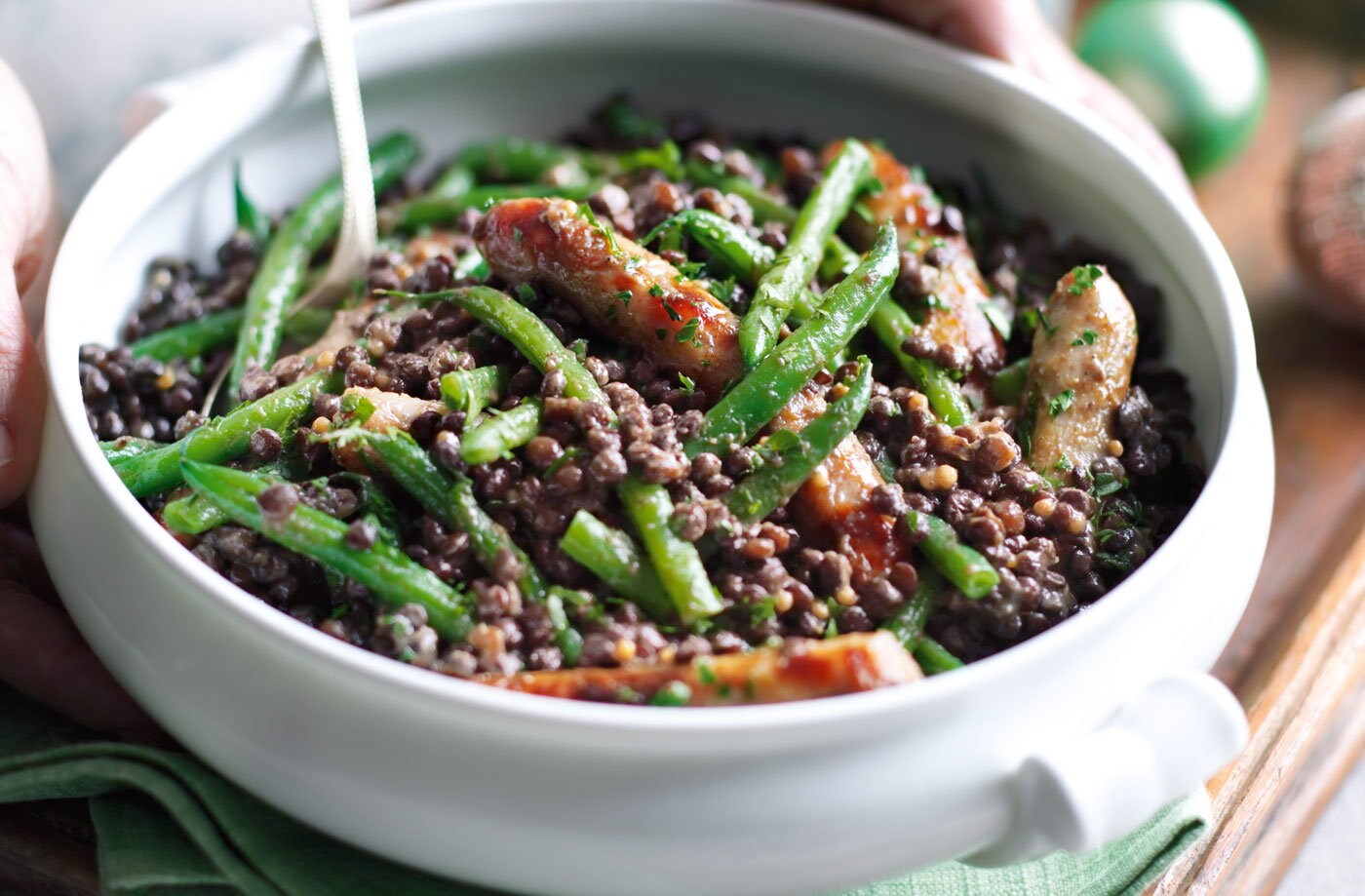 Puy lentils with chipolatas, green beans and sweet mustard dressing