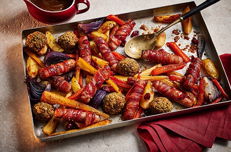 Image of "Jade Greenhalgh's sticky maple pigs in blankets traybake"
