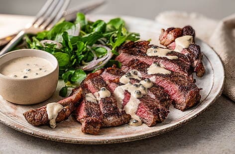 Image of "Steak with peppercorn sauce"