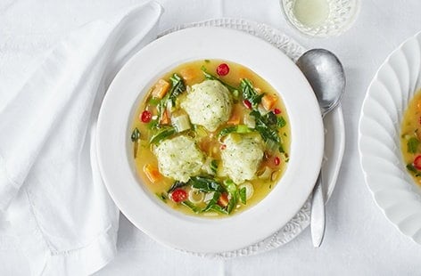 Image of "Spring vegetable broth with herby dumplings"