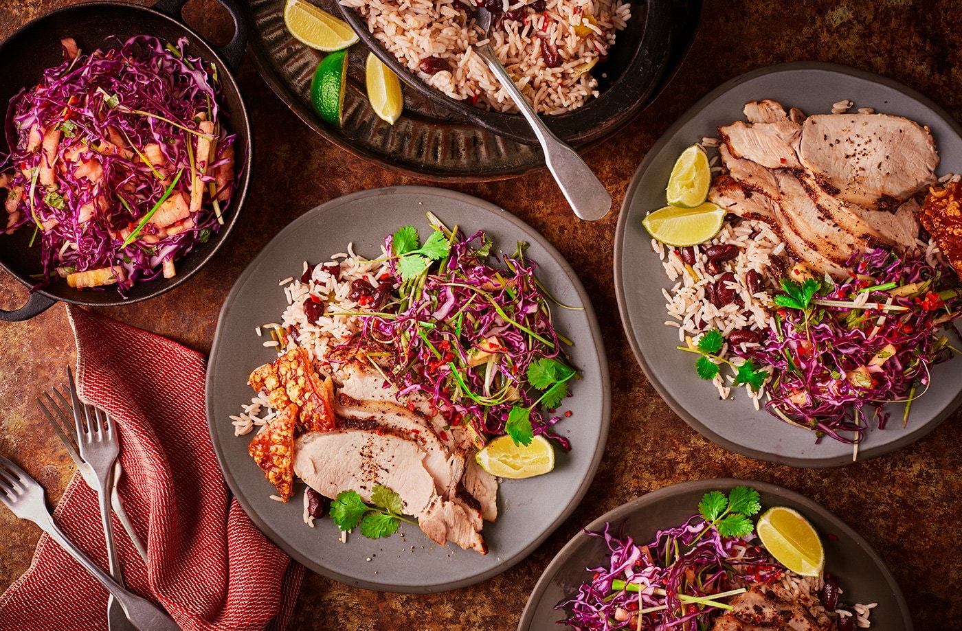 Jerk-rubbed pork with rice and peas and pineapple slaw