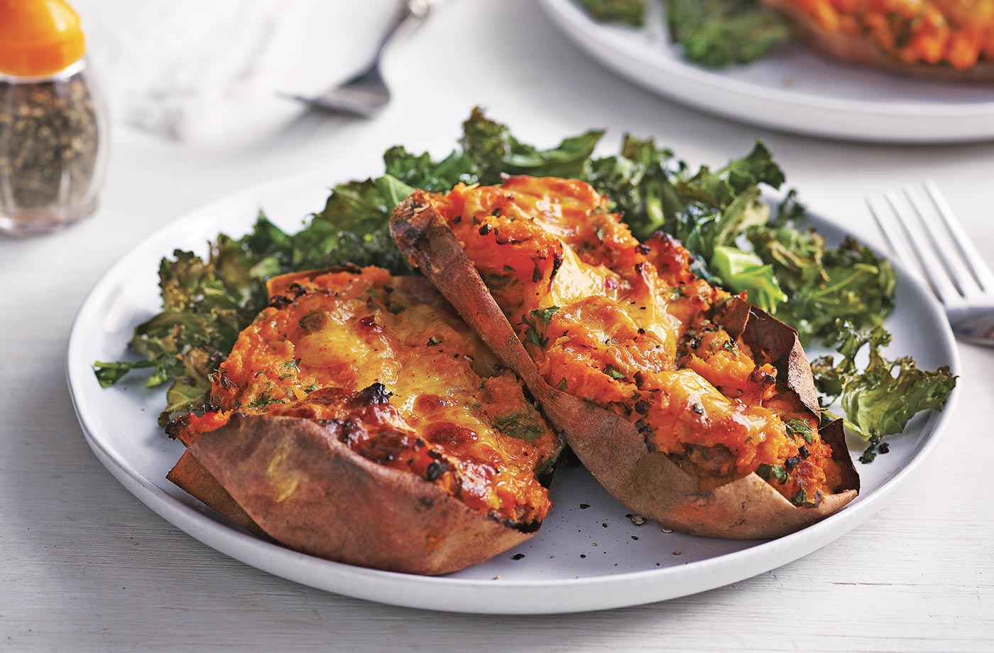 Loaded sweet potatoes with crispy kale and Cheddar