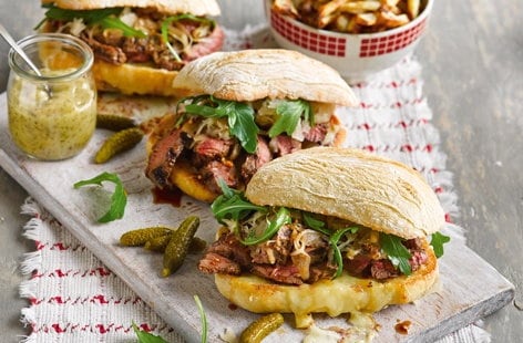 Image of "Reuben steak sandwich with skin-on fries"