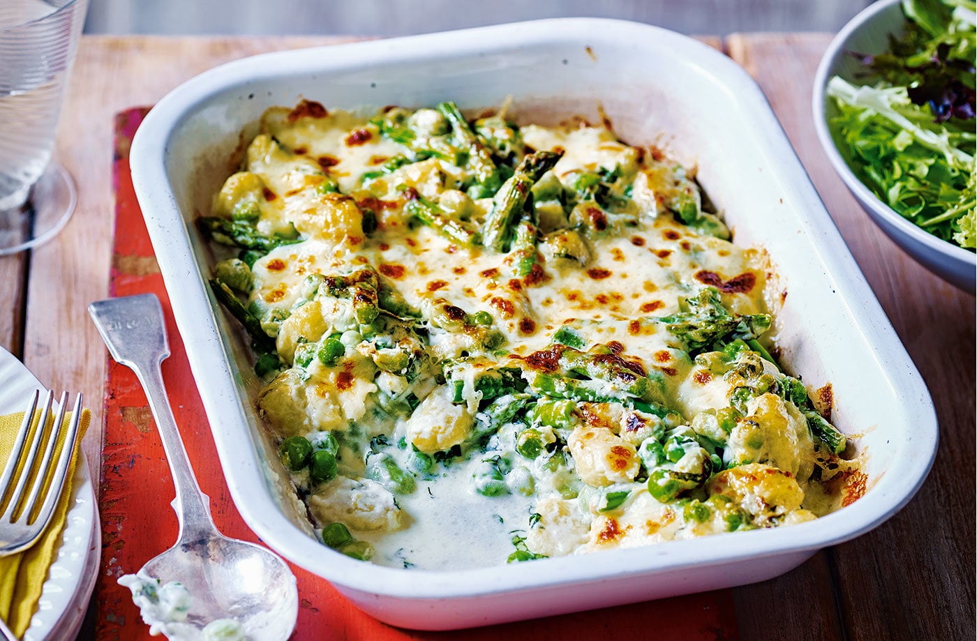 Baked gnocchi with peas and broad beans