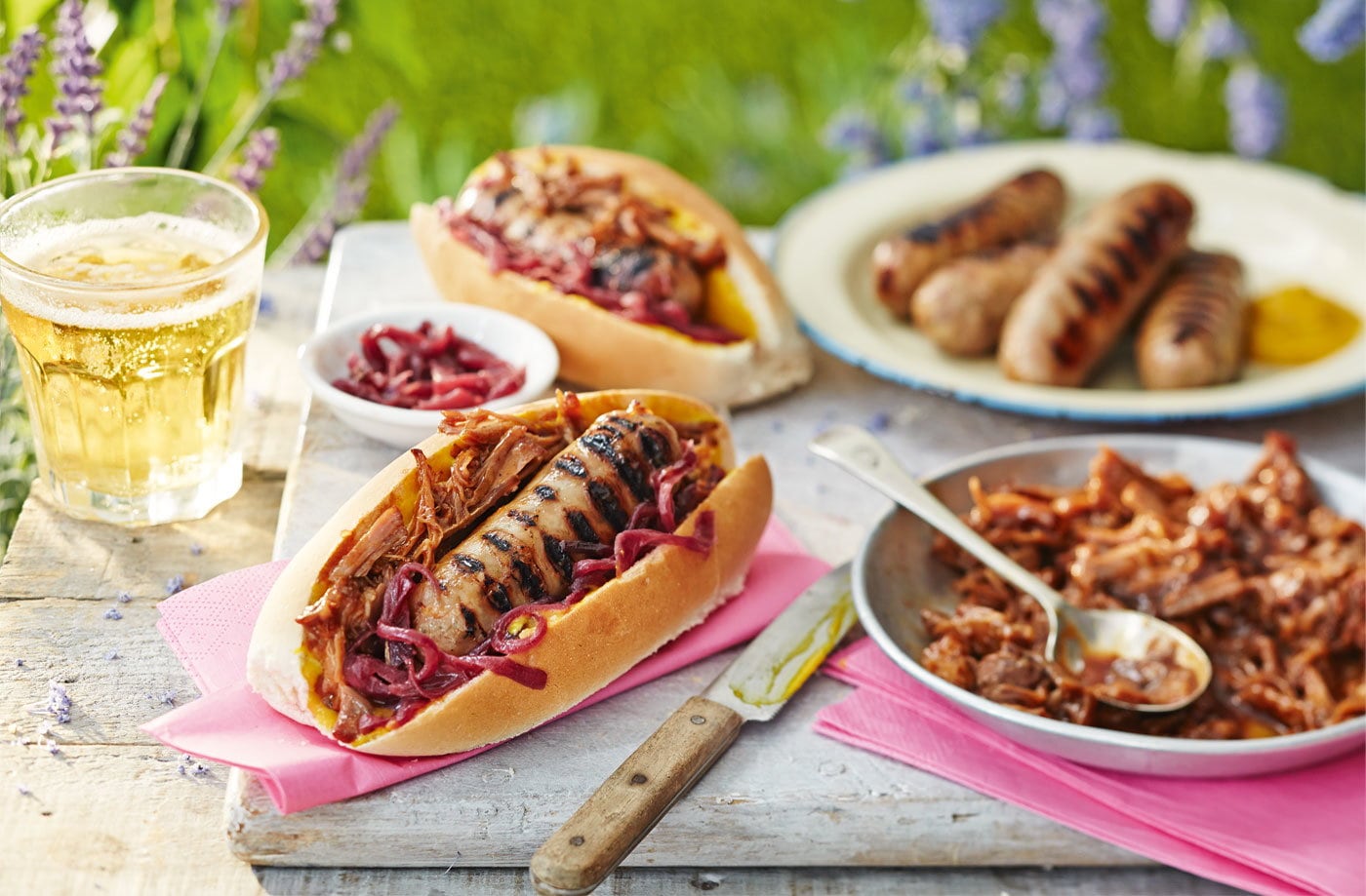 Hot dogs with pulled pork and a red onion relish
