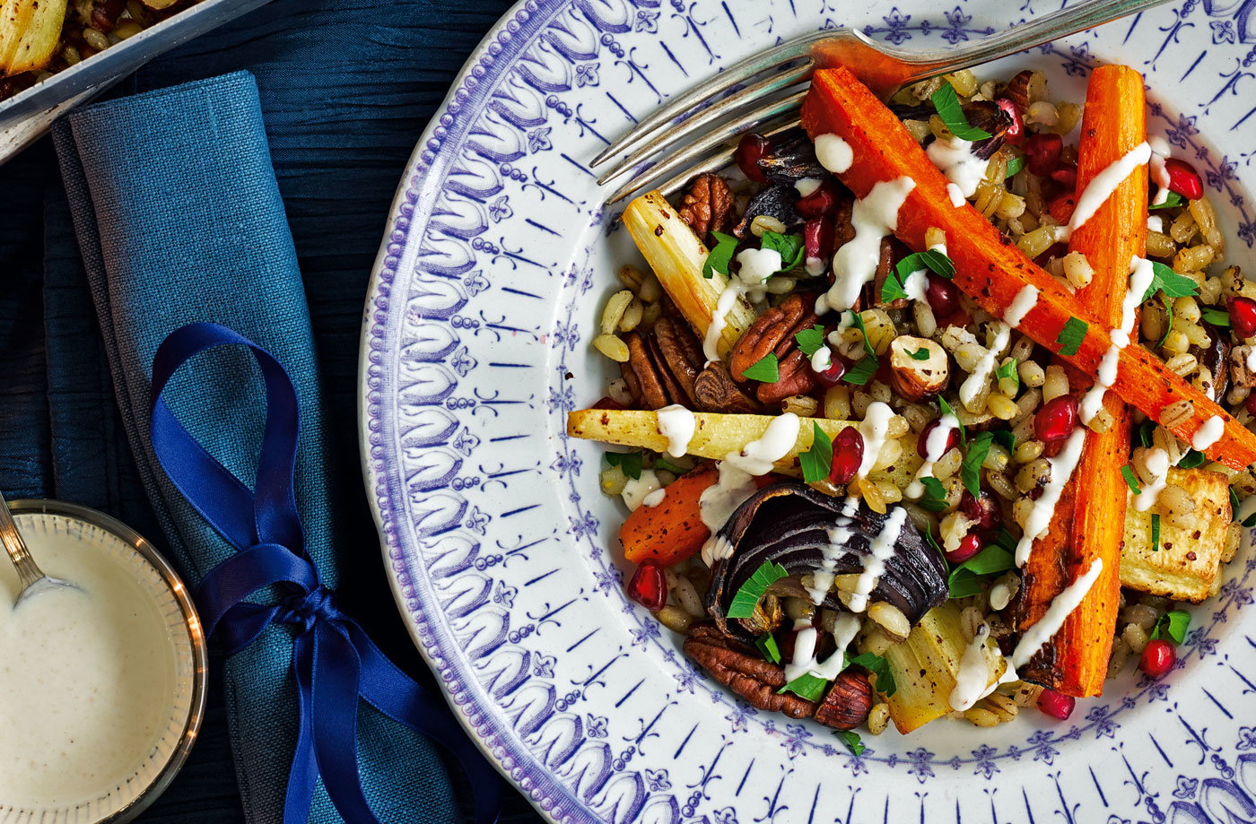 Root and nut traybake with pomegranate and yogurt dressing