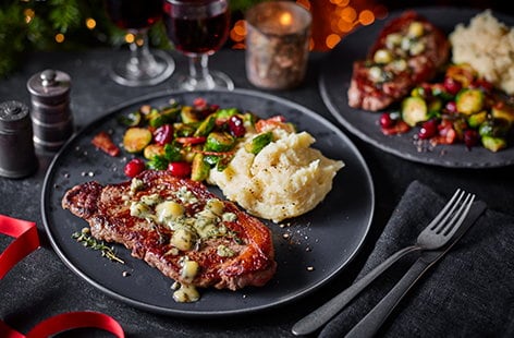 Image of "Sirloin steak with blue cheese, balsamic Brussels and horseradish mash"