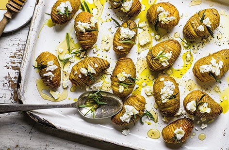 Image of "Hasselback potatoes with goat's cheese and honey"
